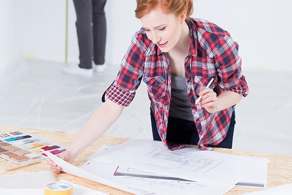 Woman designer with interior projects
